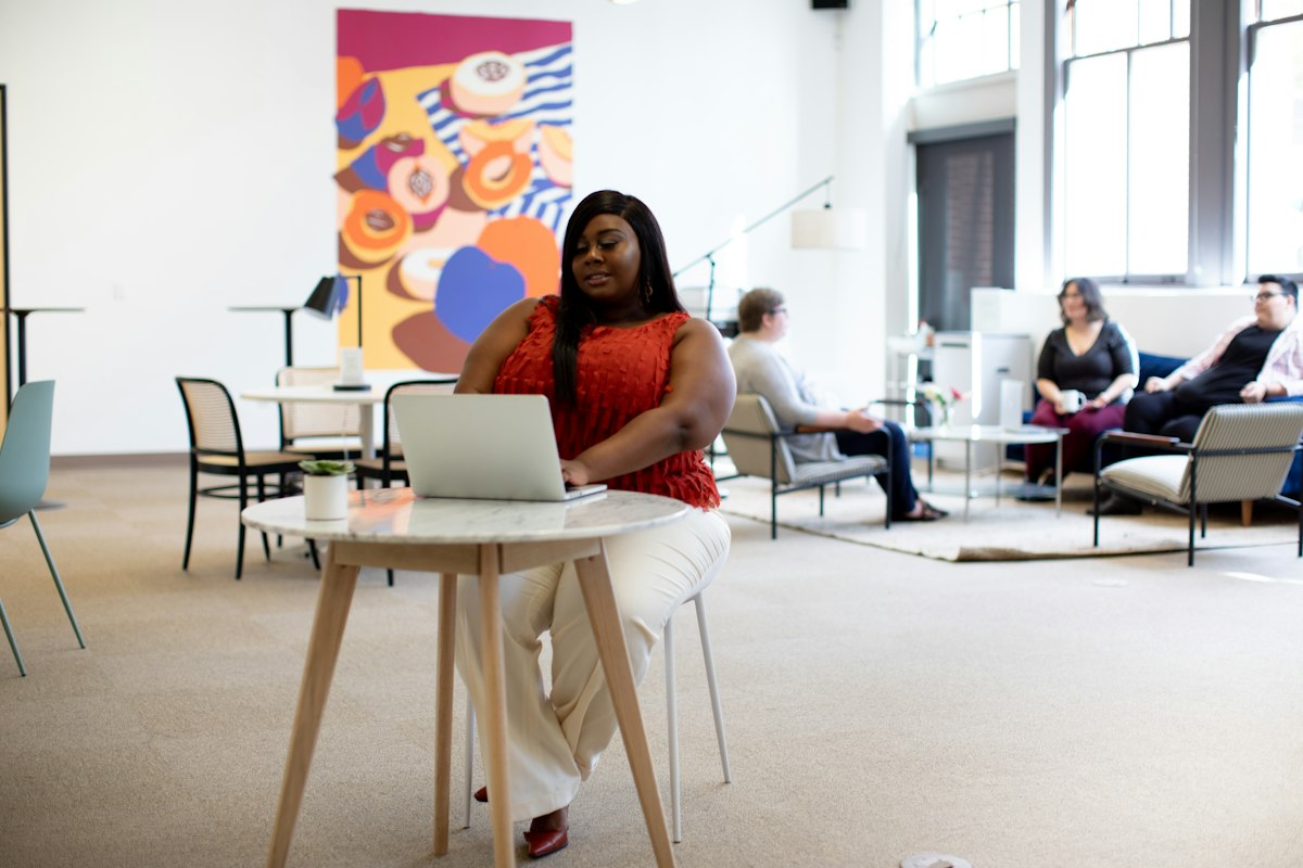A person completing a course on a laptop